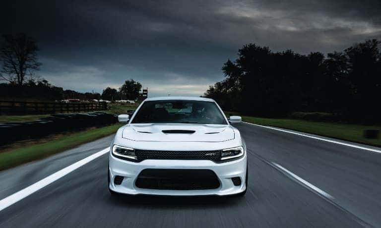 White Dodge Charger on road
