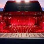 Red 2019 Chevy Silverado trunk close-up with snowy mountain background