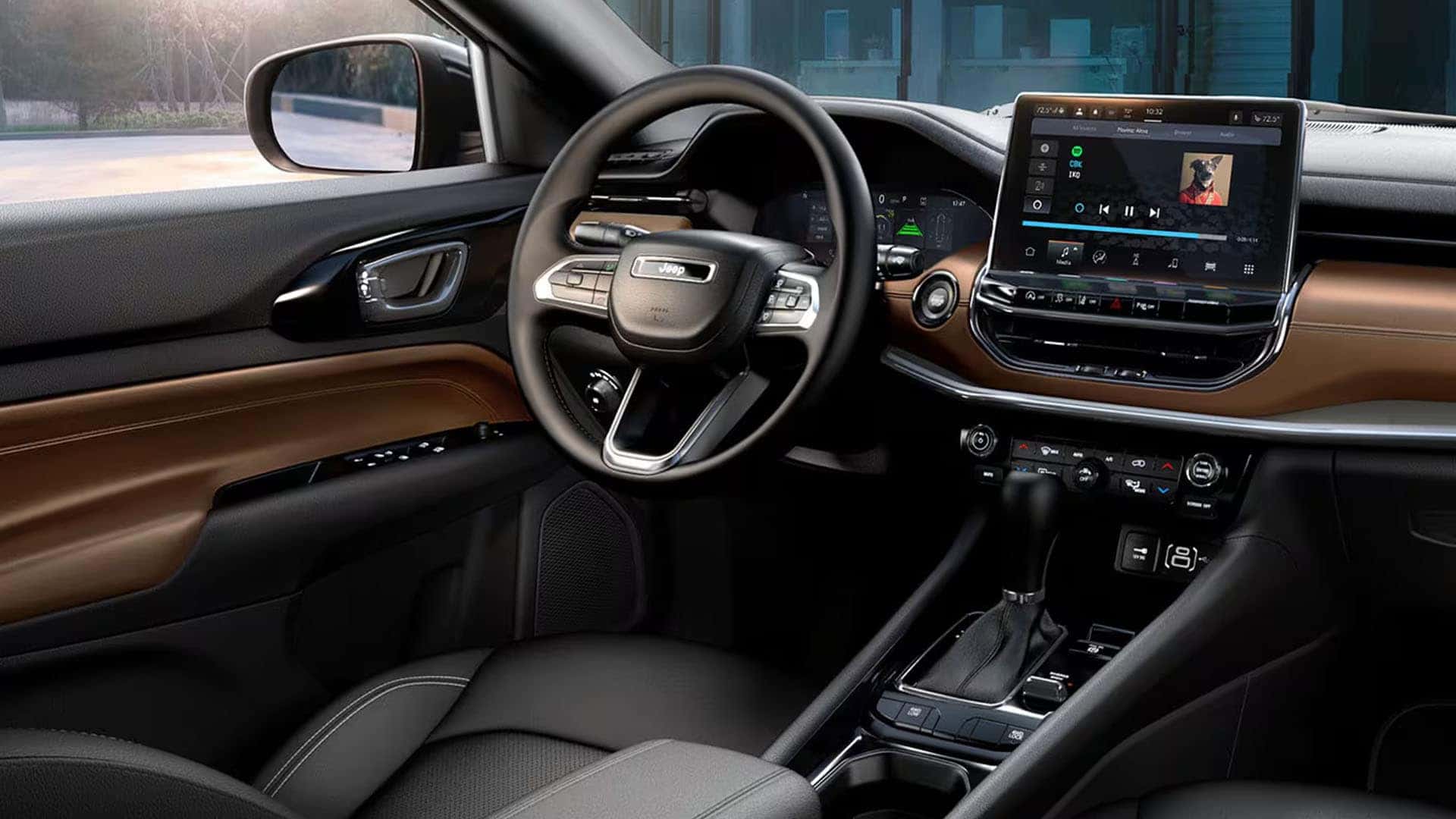 2025 Jeep Compass interior with brown and black dashboard, touchscreen, and steering wheel