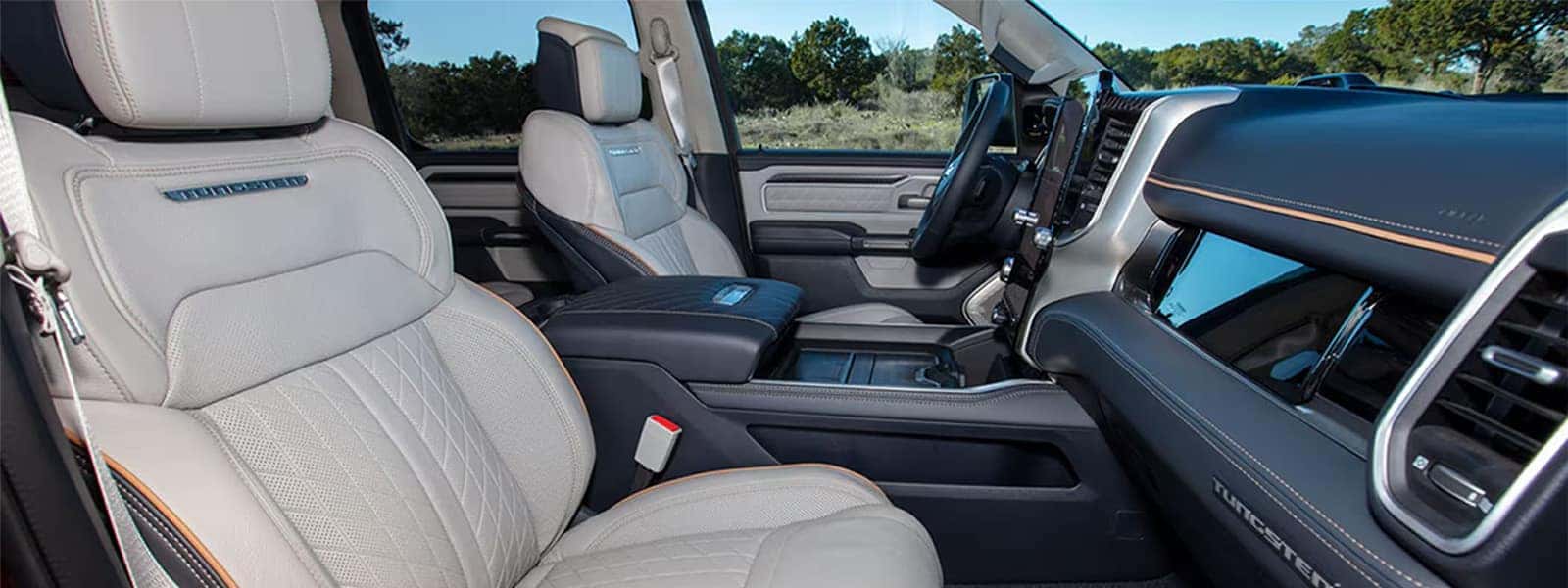 2025 Ram 1500 interior hero image with Uconnect 5 touchscreen and premium seating