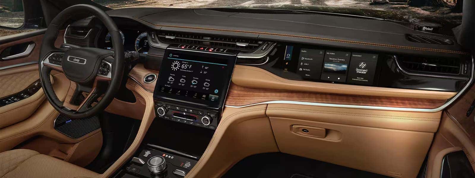 2025 Jeep Grand Cherokee interior with Uconnect touchscreens and digital displays