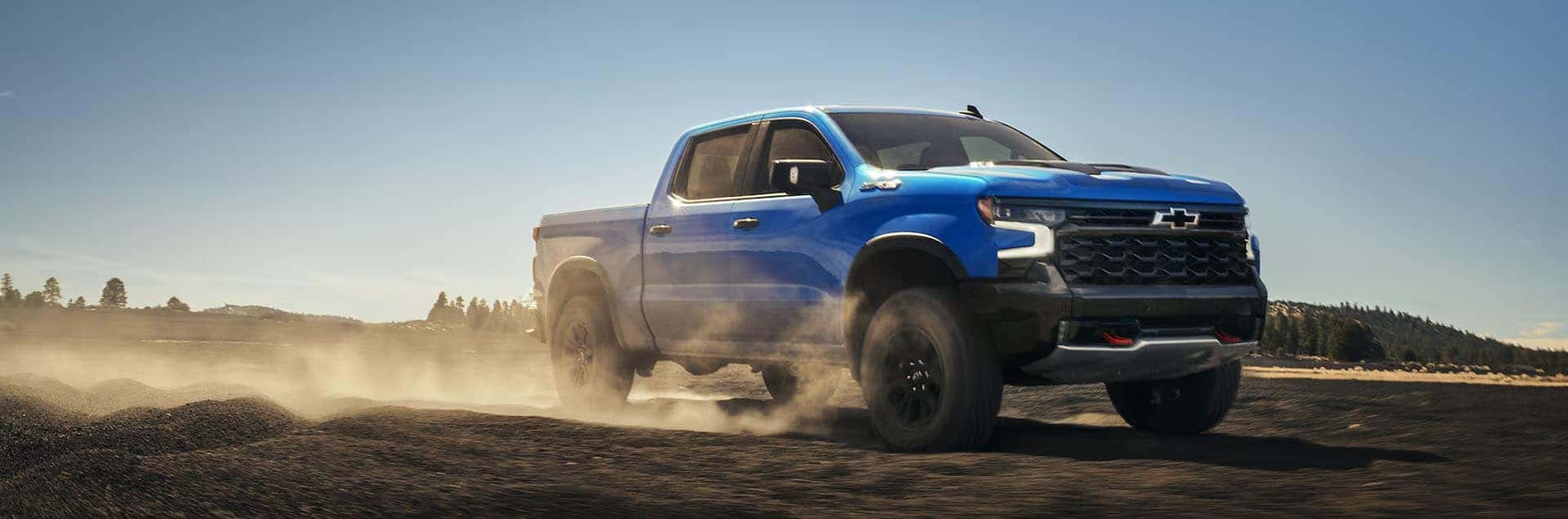 2026 Chevy Silverado 1500 driving on rugged terrain