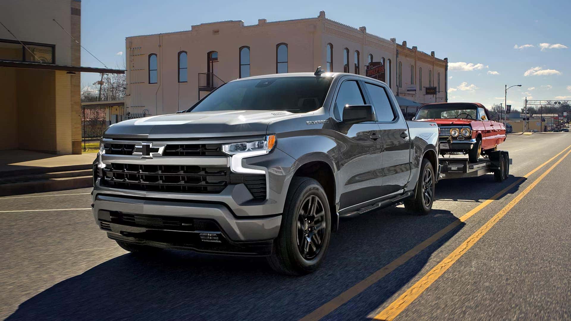 2026 Chevy Silverado 1500 towing a trailer on the road