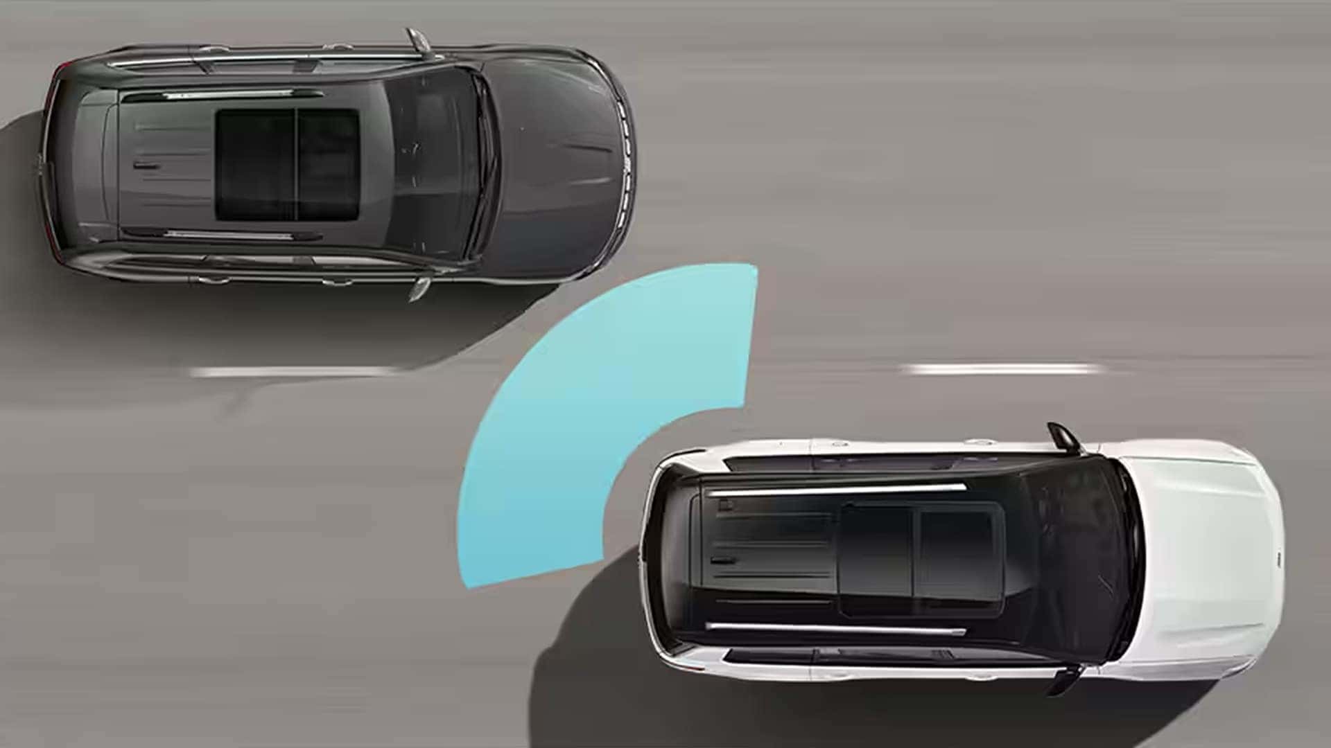2025 Jeep Grand Cherokee towing an enclosed trailer with camera views on the touchscreen