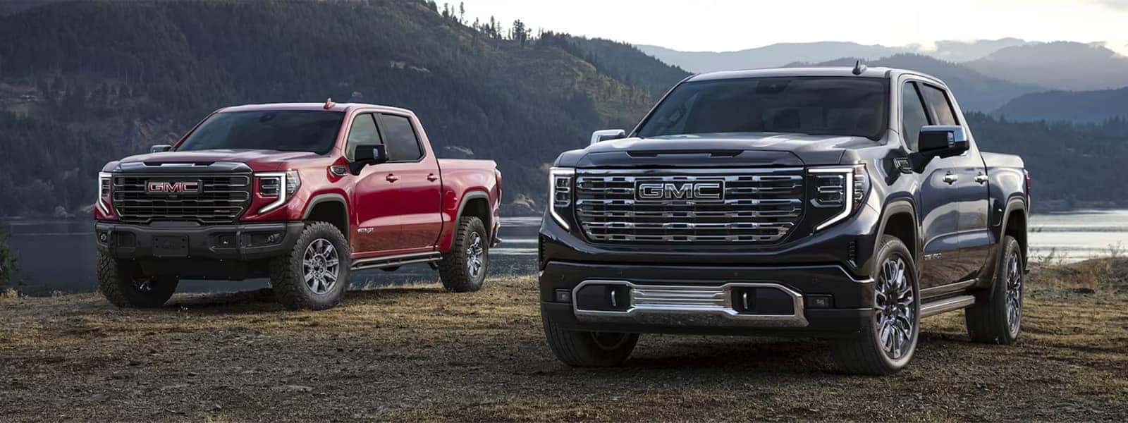 2026 GMC Sierra 1500 pickup trucks parked outdoors showing rugged design and premium trim styling