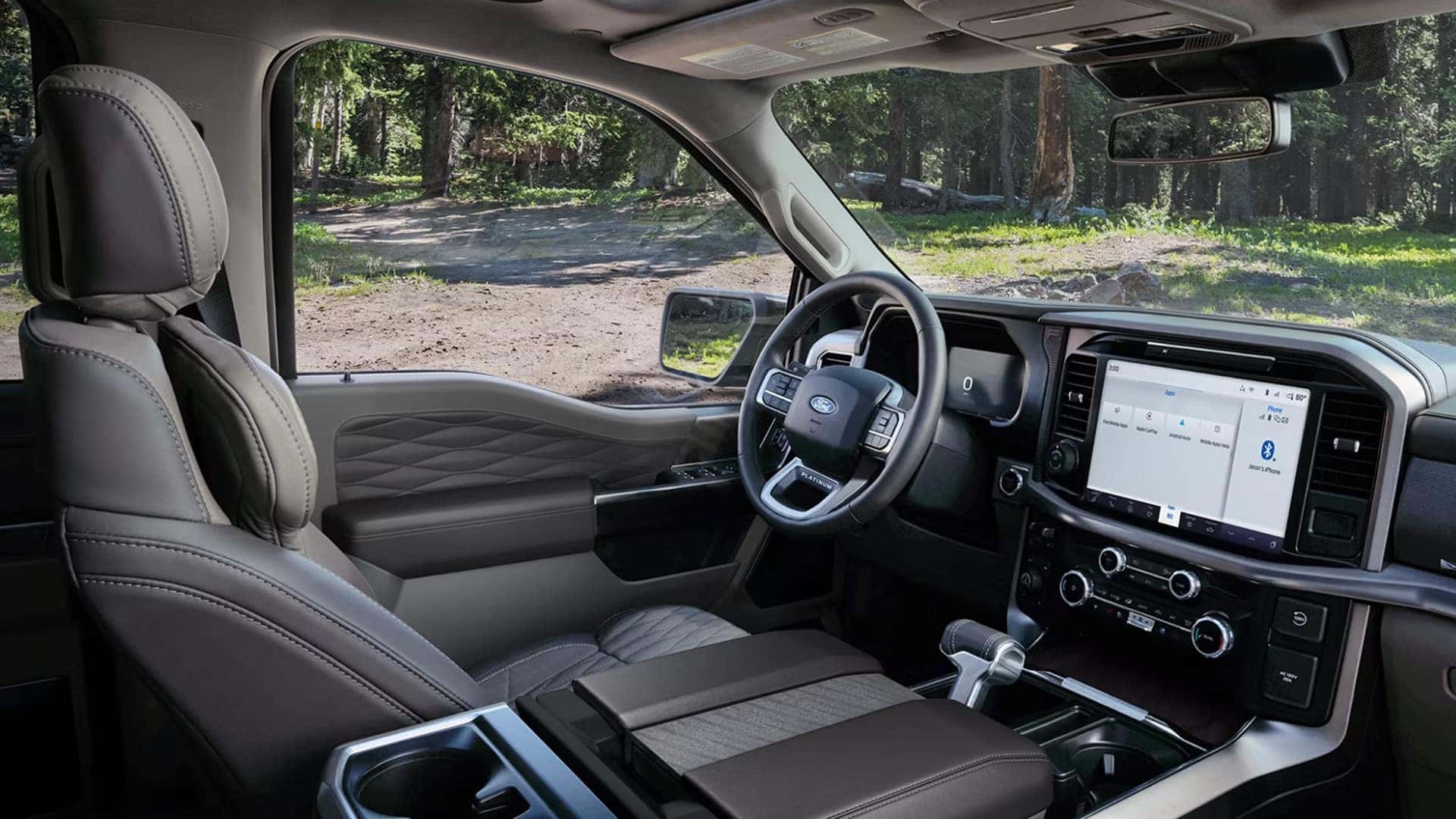2026 Ford F-150 front cabin view showing steering wheel, digital displays, and 12-inch touchscreen infotainment screen