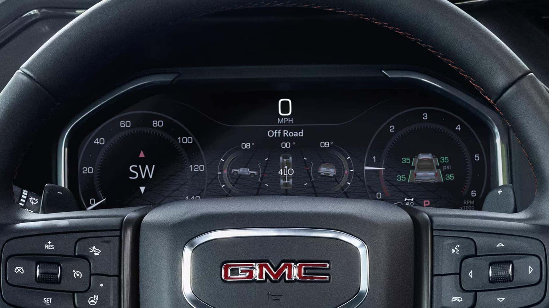 Close-up view of the 2026 GMC Sierra 1500 digital instrument cluster displaying speed, off-road drive information, and vehicle status data.