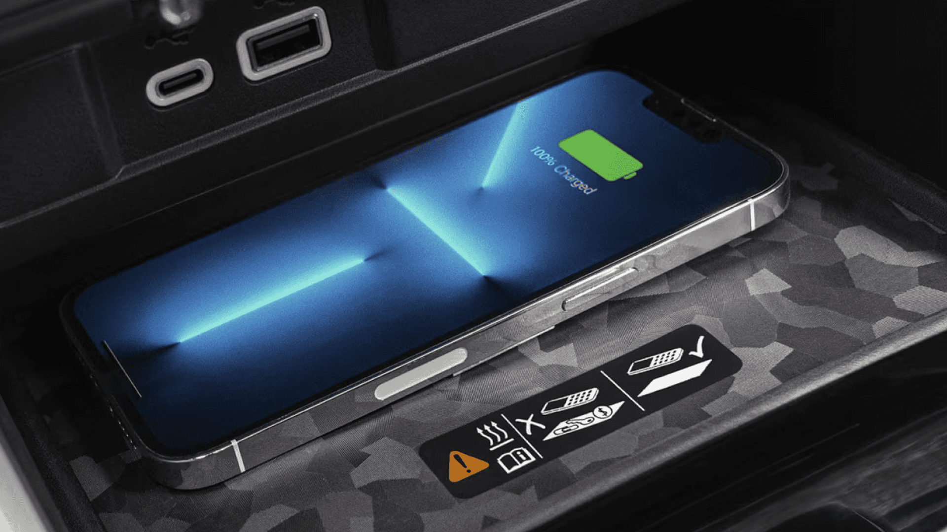 Smartphone charging wirelessly on a charging pad inside the Chevy Colorado center console