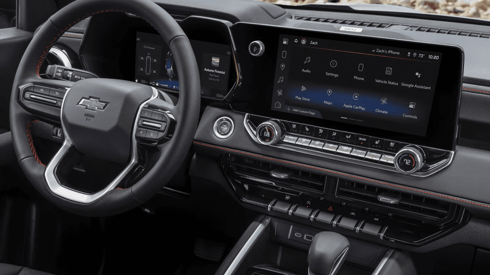Chevy Colorado interior showing the steering wheel, digital instrument cluster, and center infotainment screen with app menu