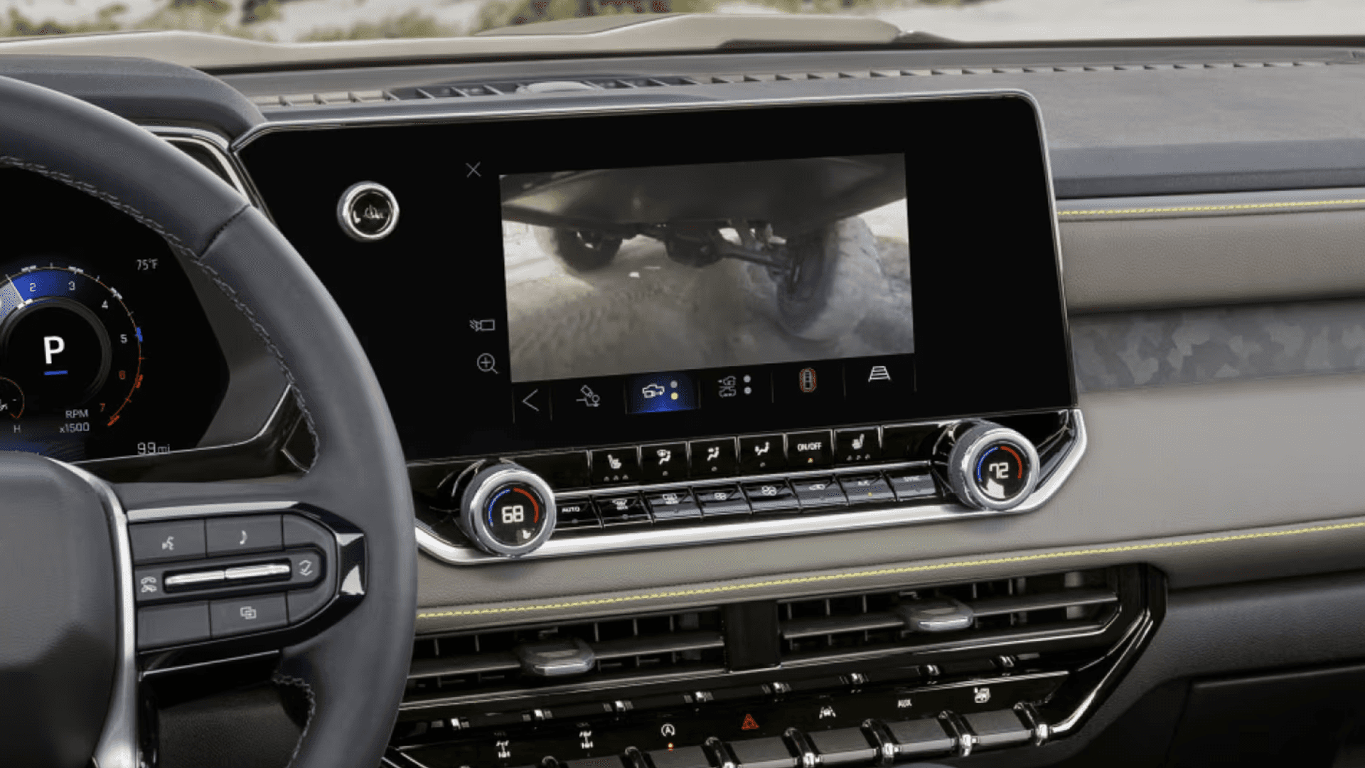 Chevy Colorado infotainment screen displaying an underbody camera view while driving off road