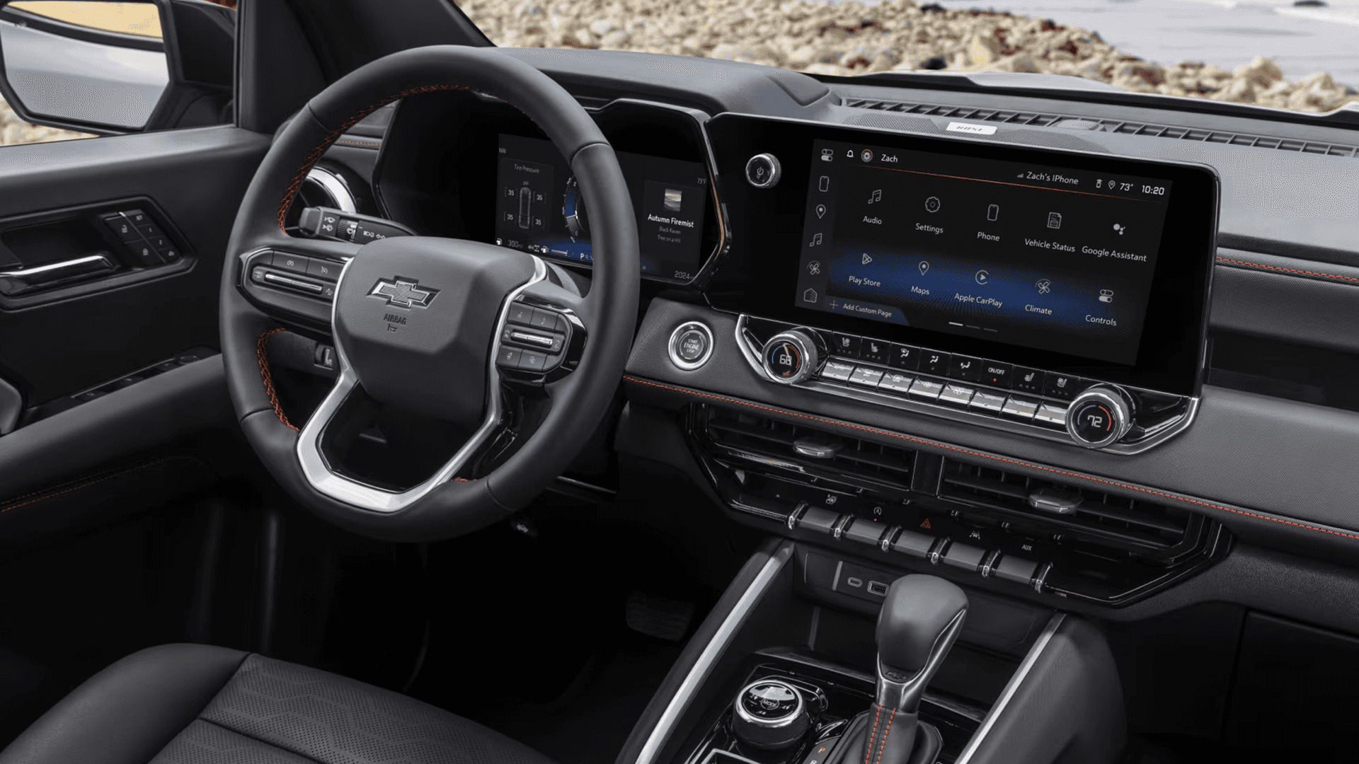 Interior of a Chevy Colorado showing the dashboard, steering wheel, and center infotainment screen