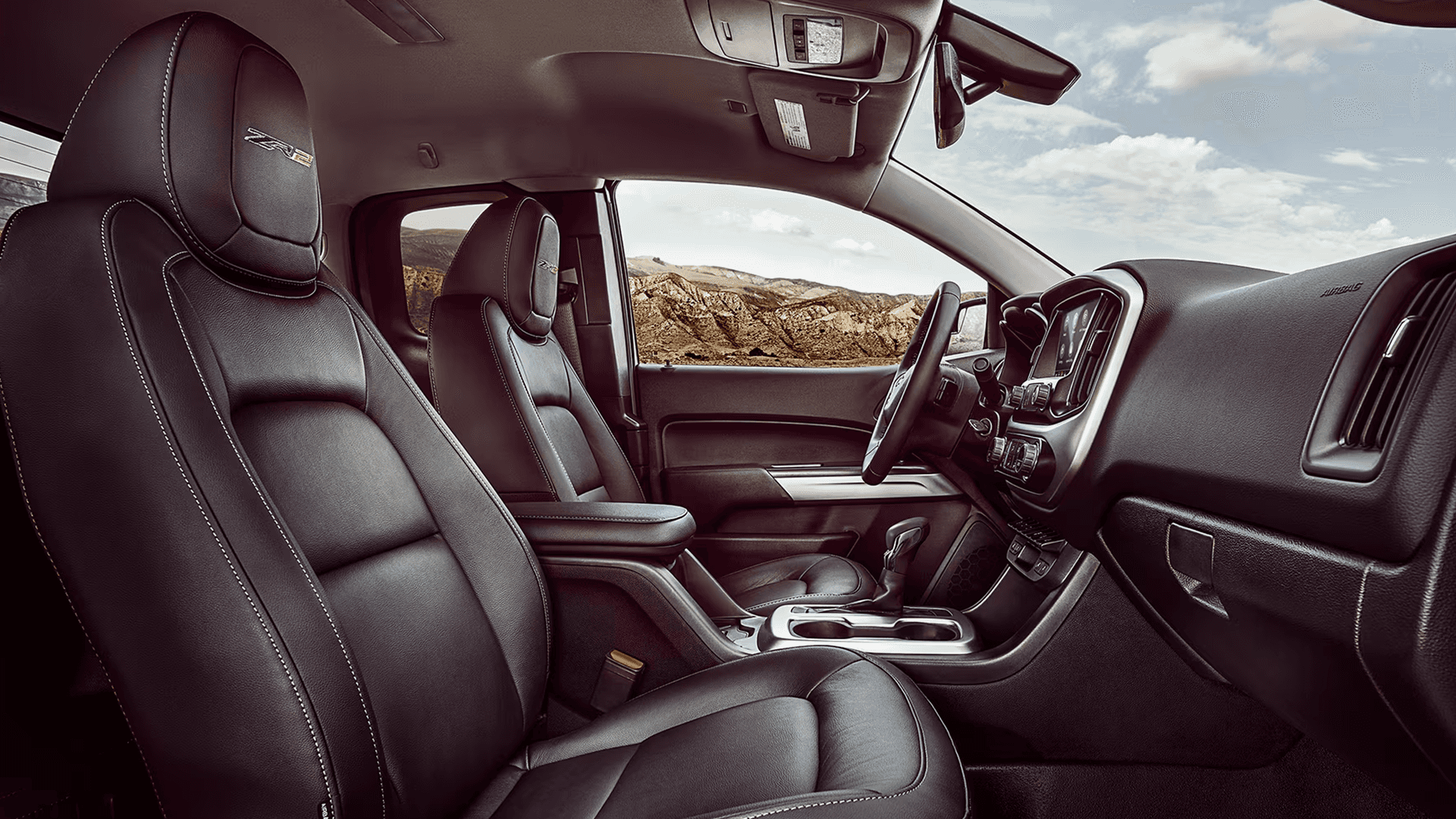 Chevy Colorado ZR2 interior with black leather front seats and center console