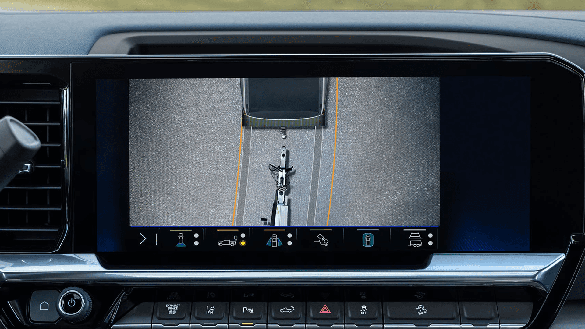 Silverado HD center display showing multiple trailering camera views including hitch view and rear trailer alignment while towing