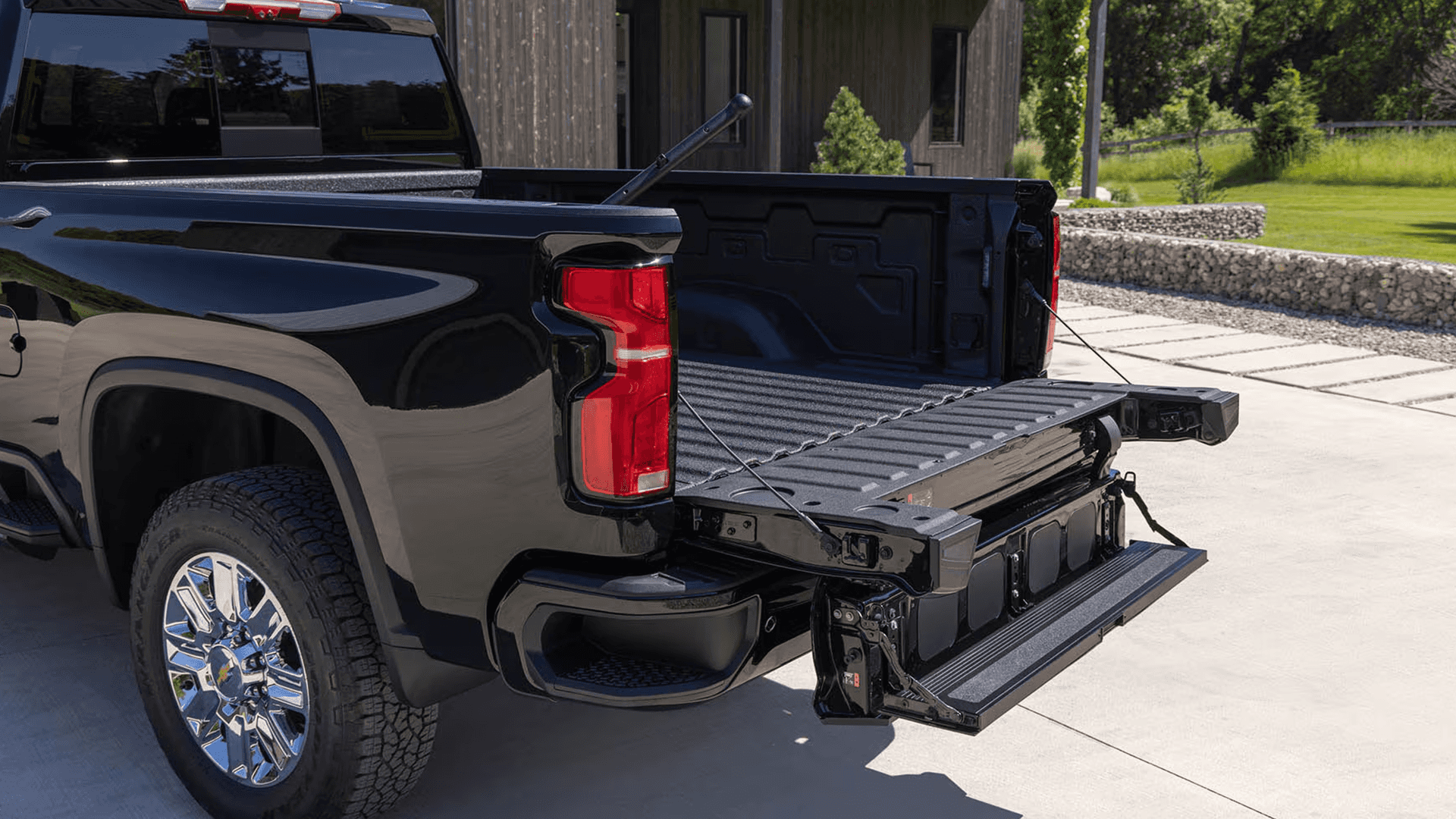 2026 Chevy Silverado HD with tailgate lowered showing multi function tailgate steps and load stop design for easier bed access