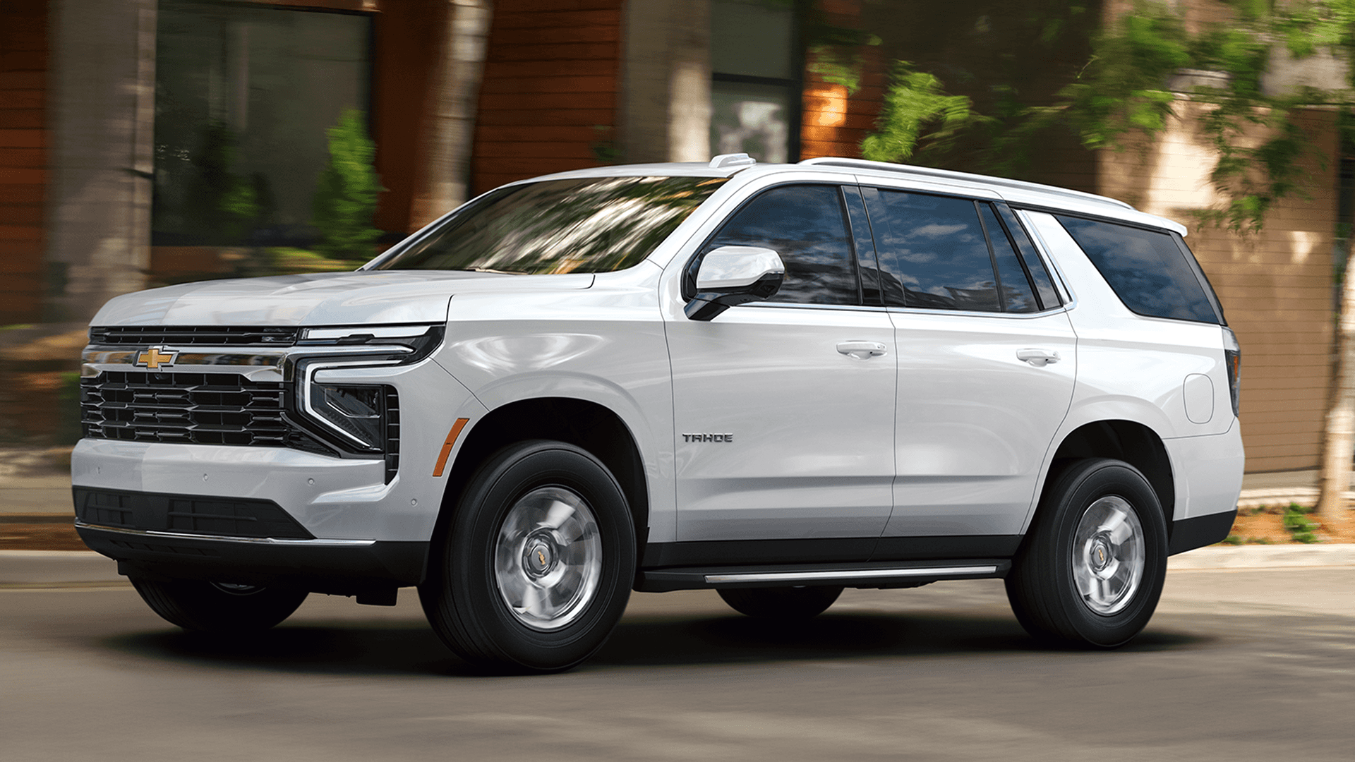 white 2026 Chevrolet Tahoe parked on a street showing side profile and exterior proportions