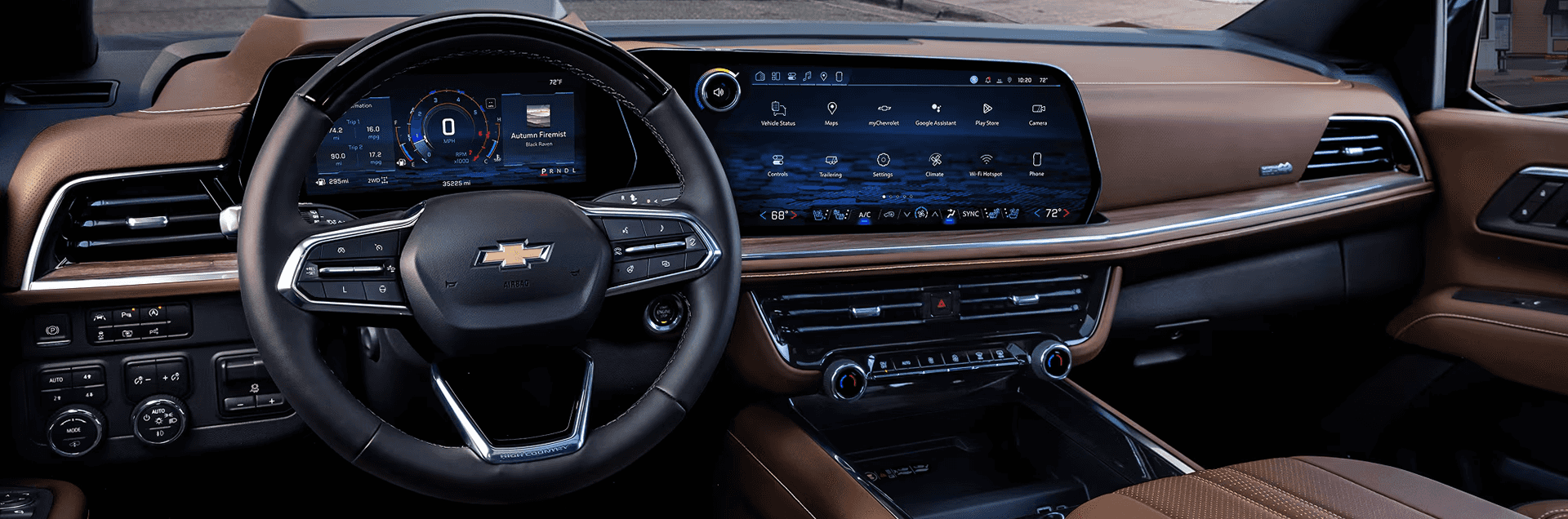 Interior dashboard of the 2026 Chevy Tahoe showing steering wheel, digital instrument cluster, and wide center touchscreen