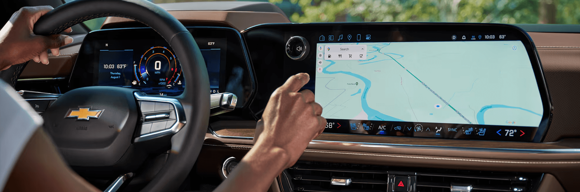 Driver view inside the 2026 Chevy Tahoe using the center touchscreen navigation system and digital gauge display