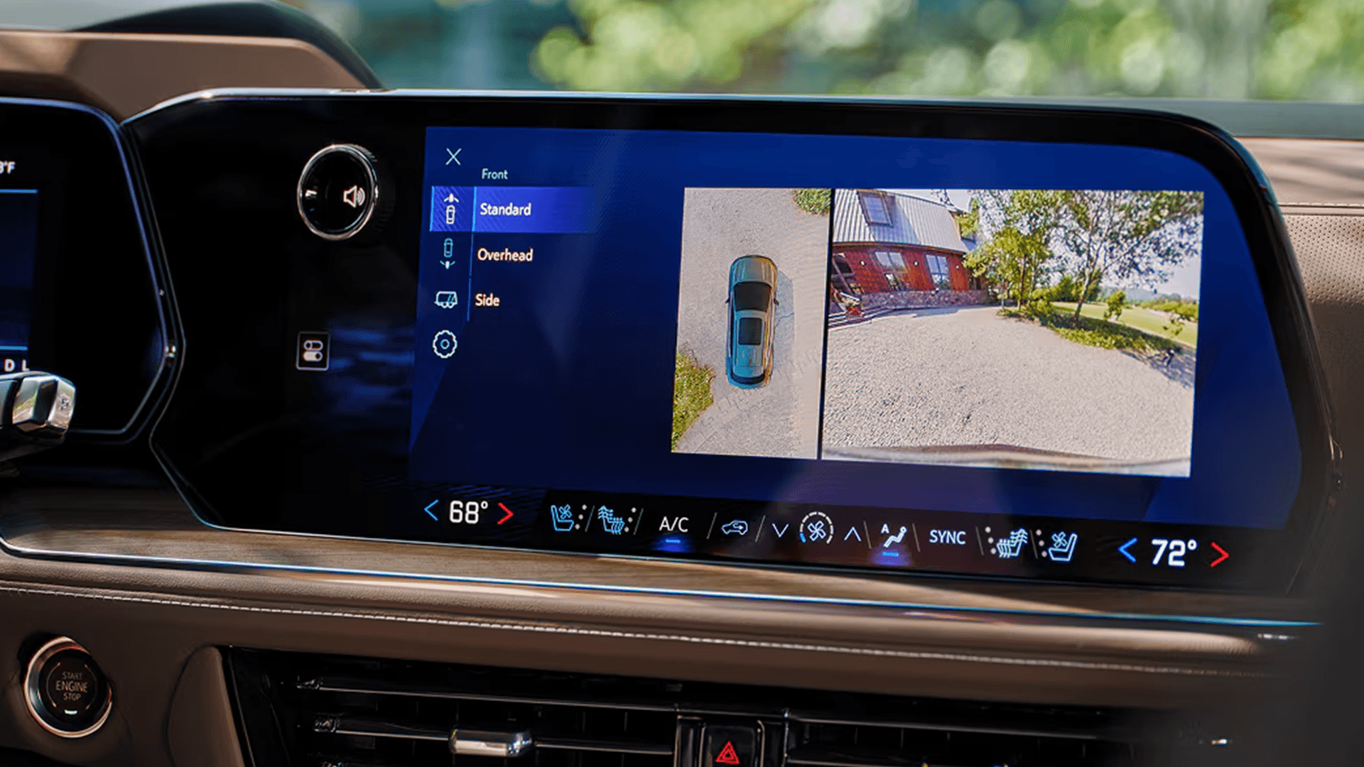 Center touchscreen in the 2026 Chevy Tahoe displaying surround view camera system with overhead and front camera views