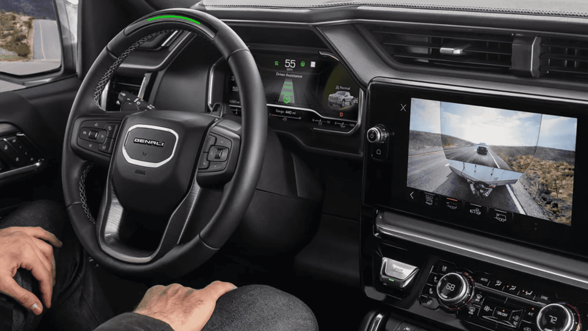 Driver seat view inside the 2026 Chevy Tahoe with Super Cruise active and rear trailer camera view shown on the center display
