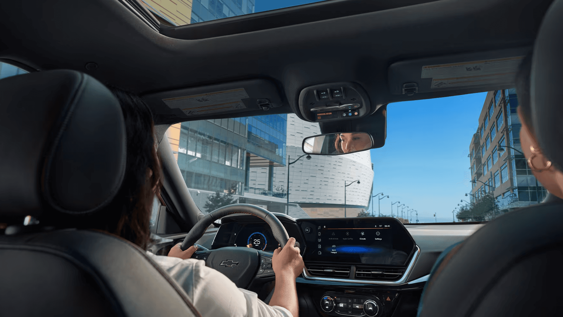 Chevy Trax interior with couple driving by the coast