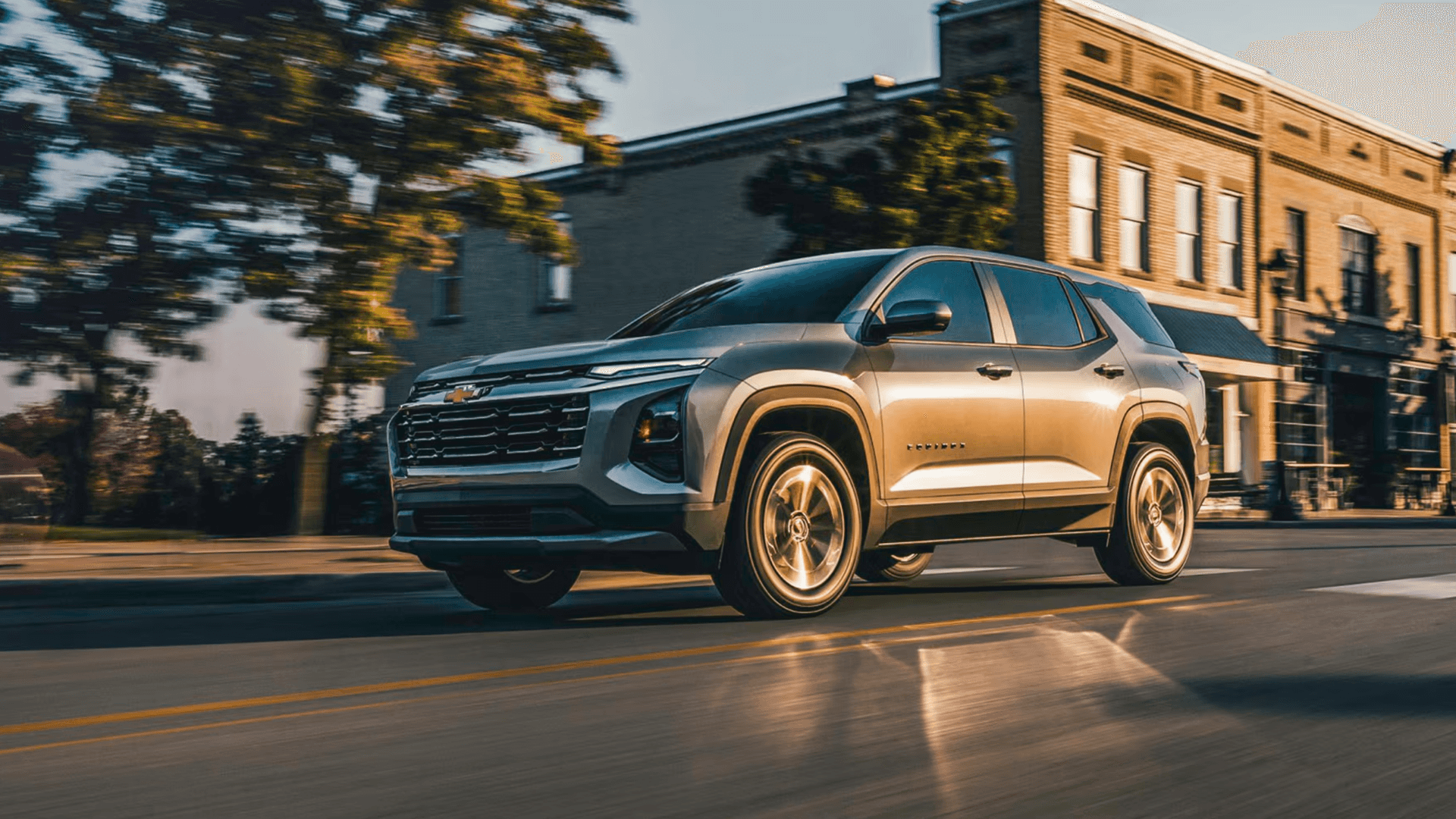 2026 Chevrolet Equinox Exterior – Urban Drive 2026 Chevrolet Equinox driving through a downtown street with brick buildings