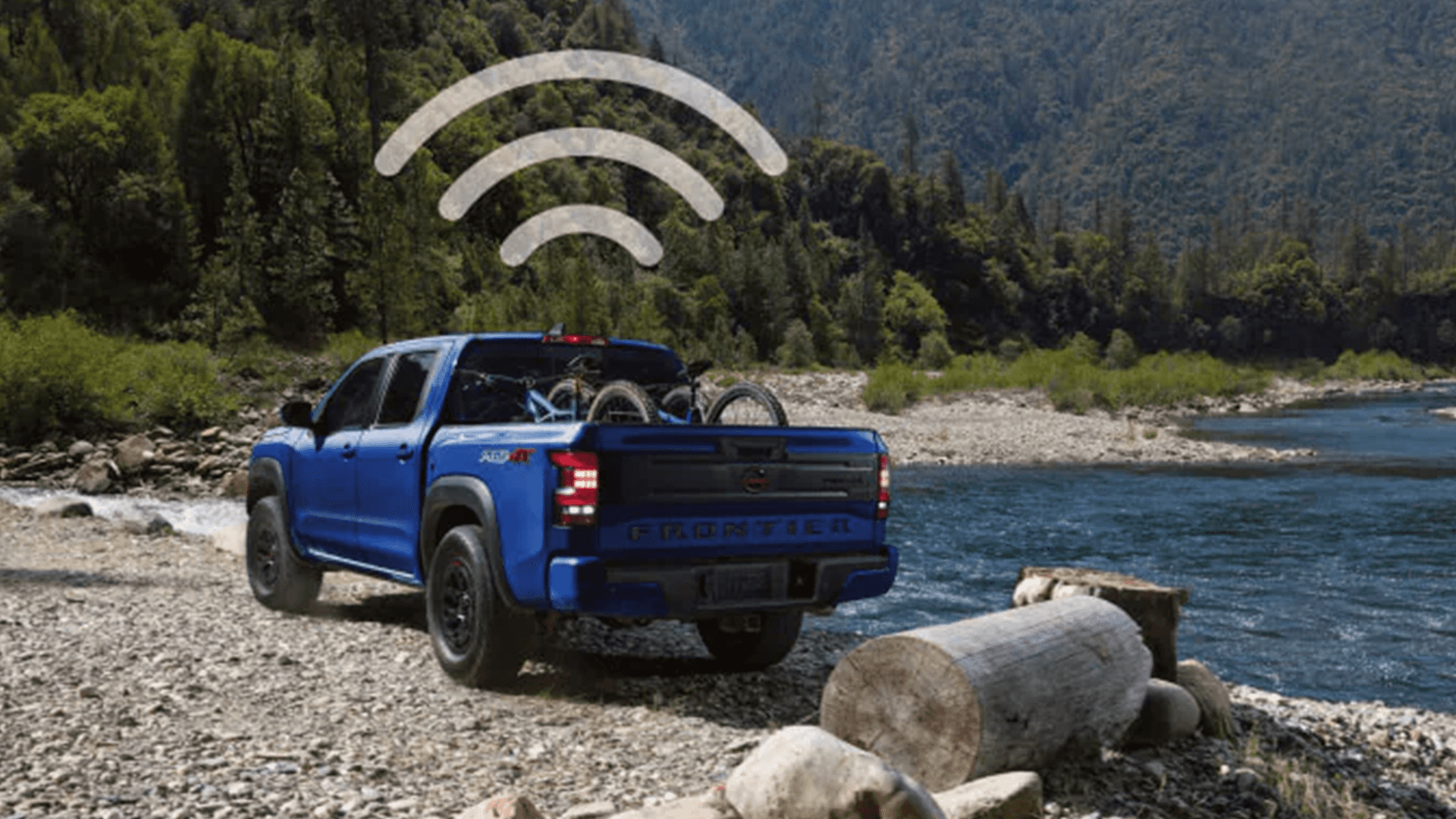 Nissan Frontier parked by a river with a Wi-Fi signal icon overlay