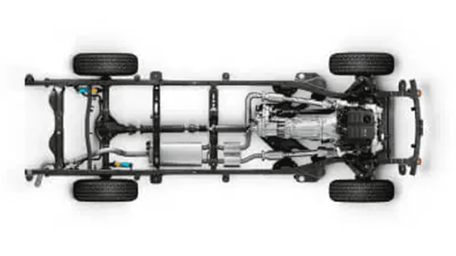 Underside view of a Nissan Frontier chassis and frame with wheels and drivetrain visible
