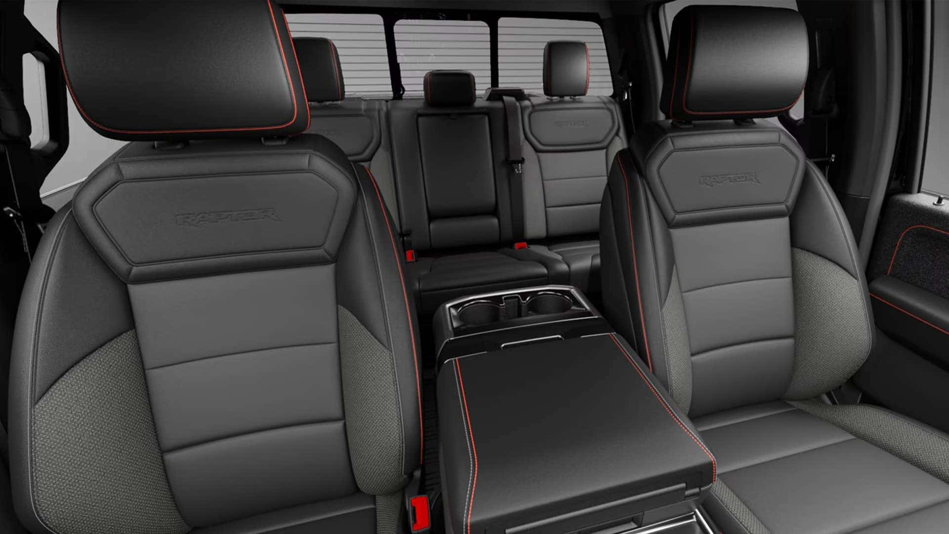 Interior of the 2026 Ford F-150 with premium front seats, center console, and rear seating, highlighting cabin space and comfort.