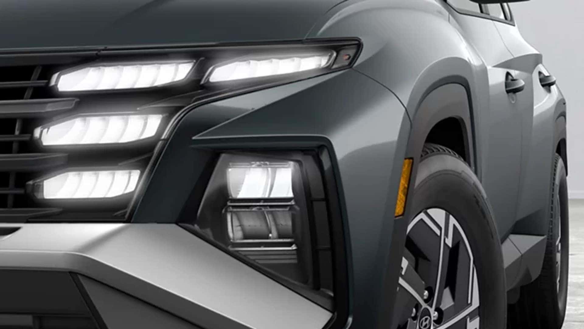 Close-up of the Hyundai Tucson Hybrid front lighting design, featuring distinctive LED daytime running lights and headlamps.