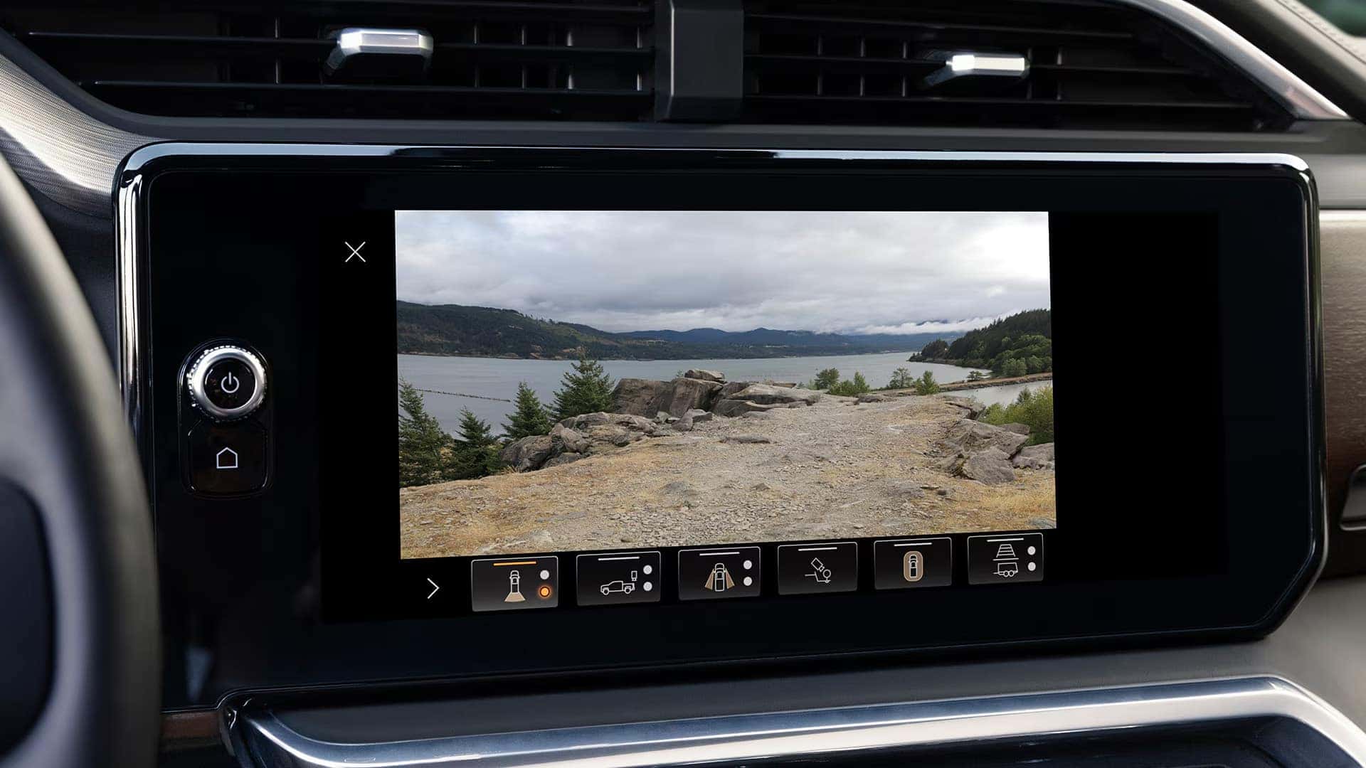 Infotainment screen in the 2026 GMC Sierra 1500 displaying a camera view with selectable camera angle icons for low-speed maneuvering.