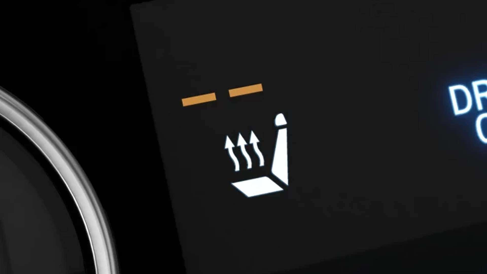 Heated seat control icon illuminated on the Hyundai Tucson Hybrid dashboard, highlighting interior comfort features.