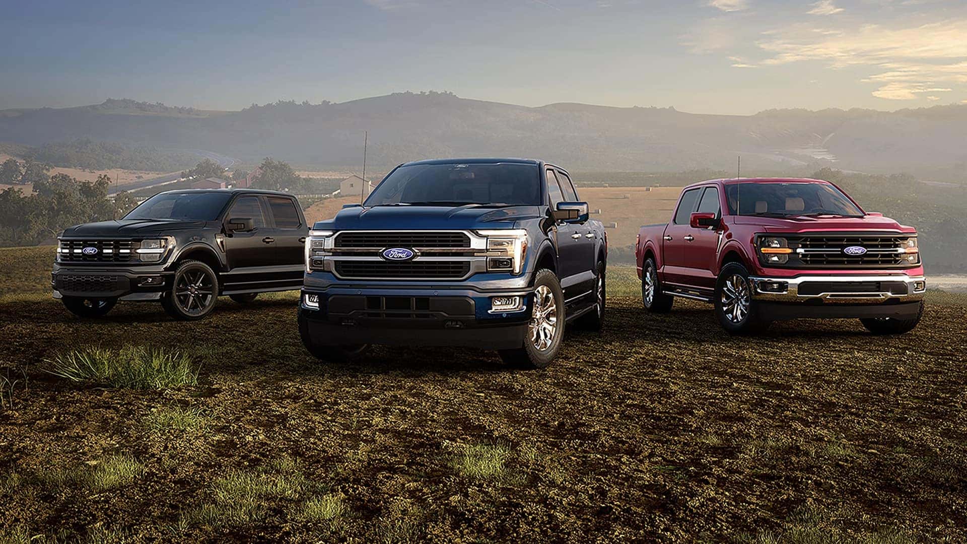 Three 2026 Ford F-150 trucks parked outdoors, illustrating different trims, exterior sizes, and full-size pickup proportions.