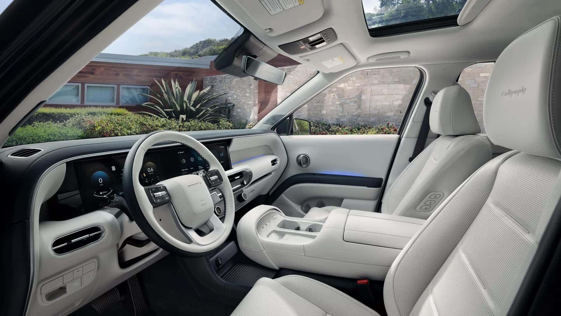 2026 Hyundai Palisade Hybrid interior design with driver focused cockpit, digital displays, and premium front seating