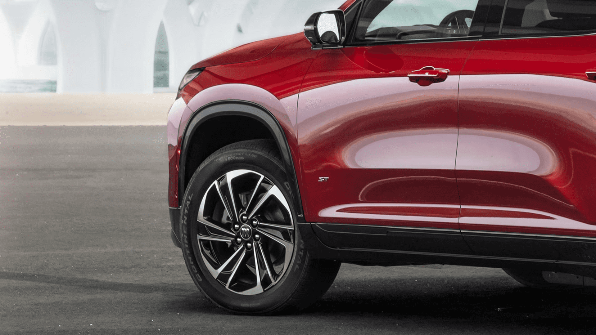 2026 Buick Enclave side view highlighting alloy wheel design and lower body trim