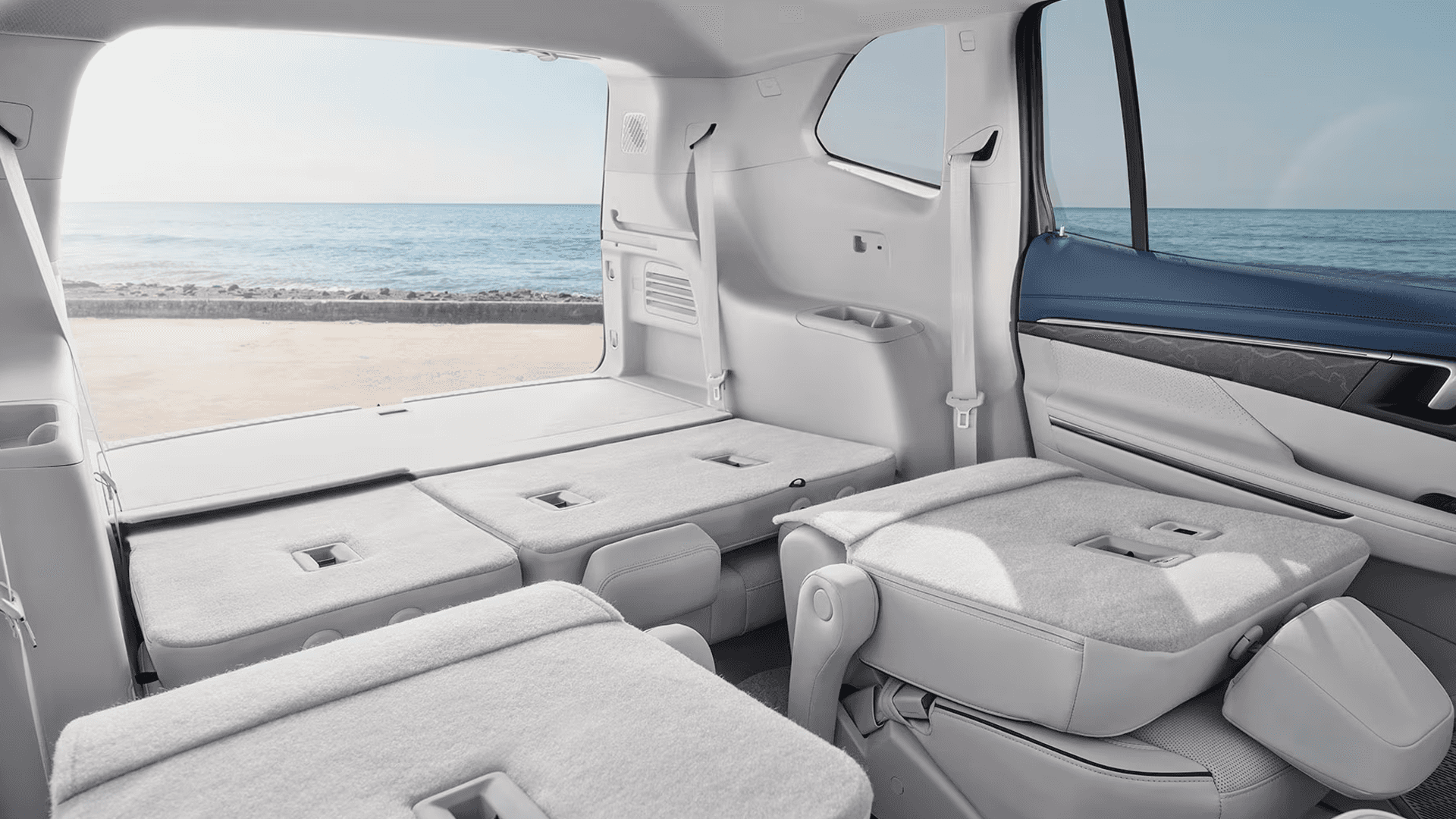 Rear interior view of the 2026 Buick Enclave with second and third row seats folded flat to show expanded cargo space.