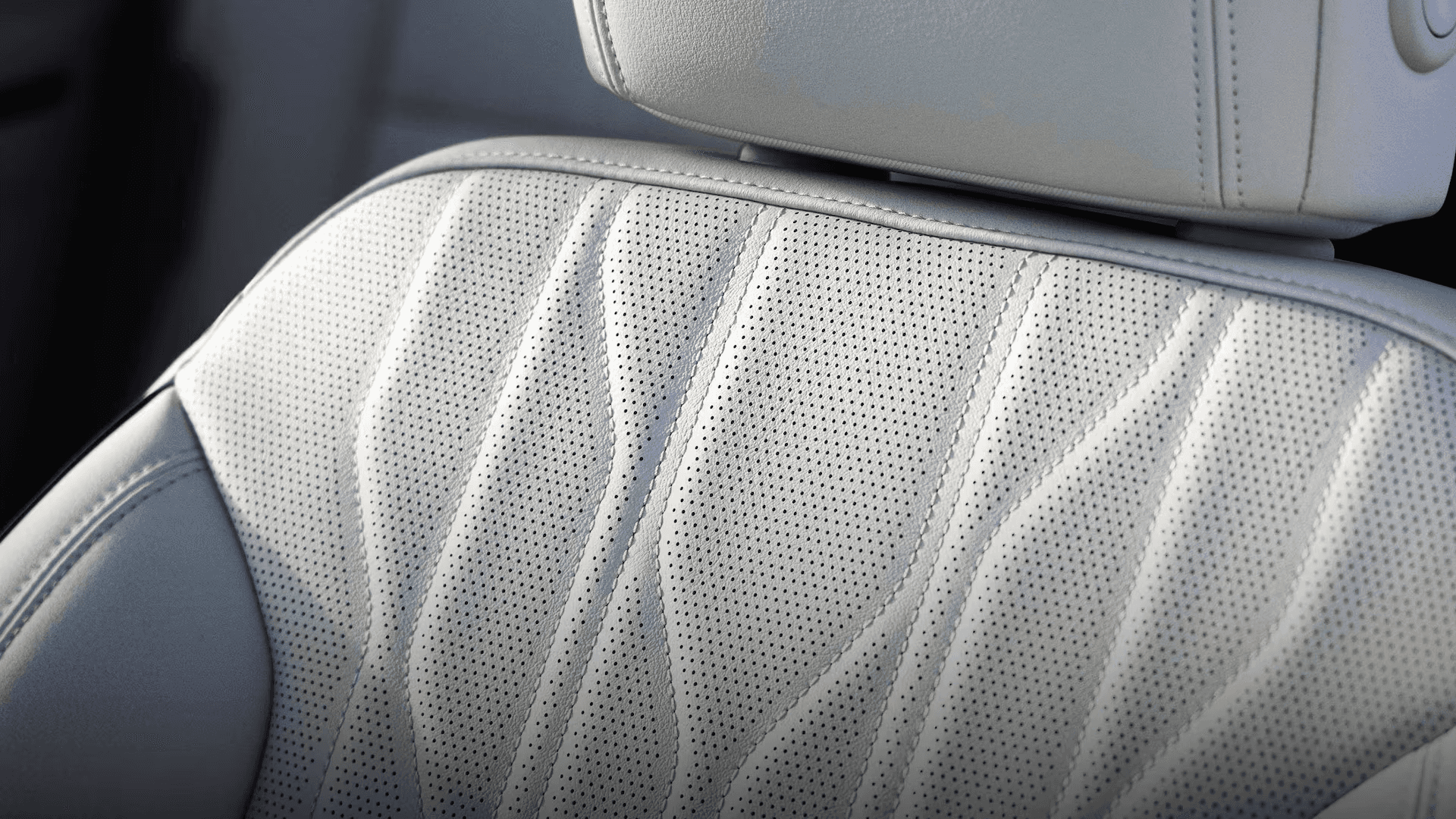 Close up of perforated leather seat upholstery with stitched pattern in the 2026 Buick Enclave