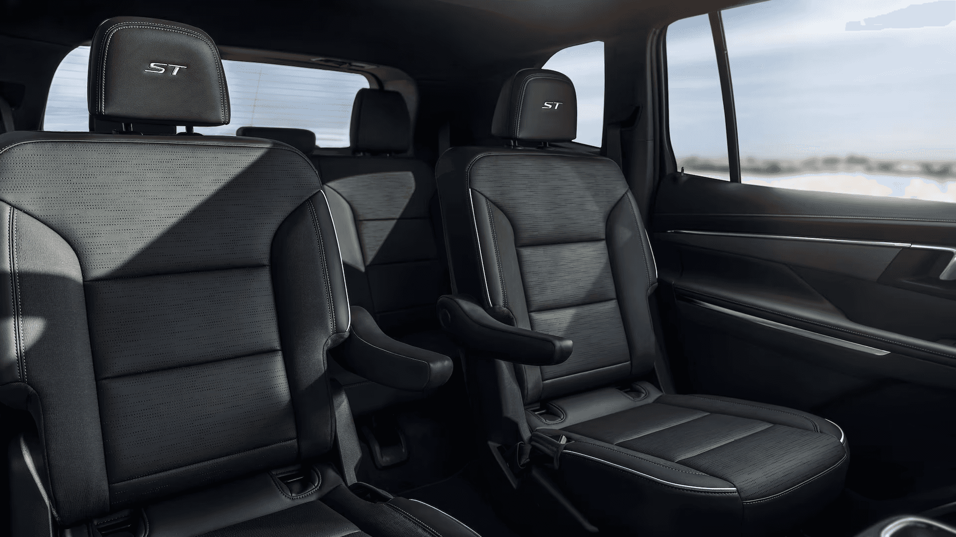 2026 Buick Enclave interior showing second row captain’s chairs and third row seating