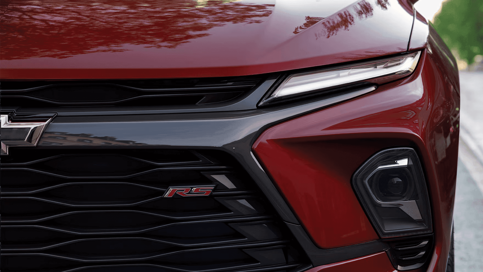Closeup of the 2026 Chevy Blazer front fascia showing headlight, grille, and RS badge