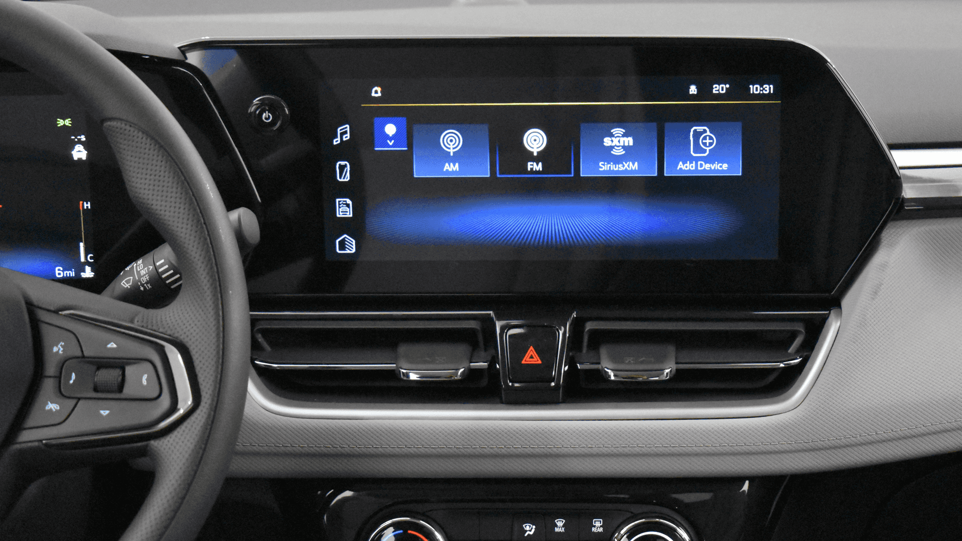 Trailblazer interior showing the 11 inch center touchscreen with audio sources and menu icons above climate controls