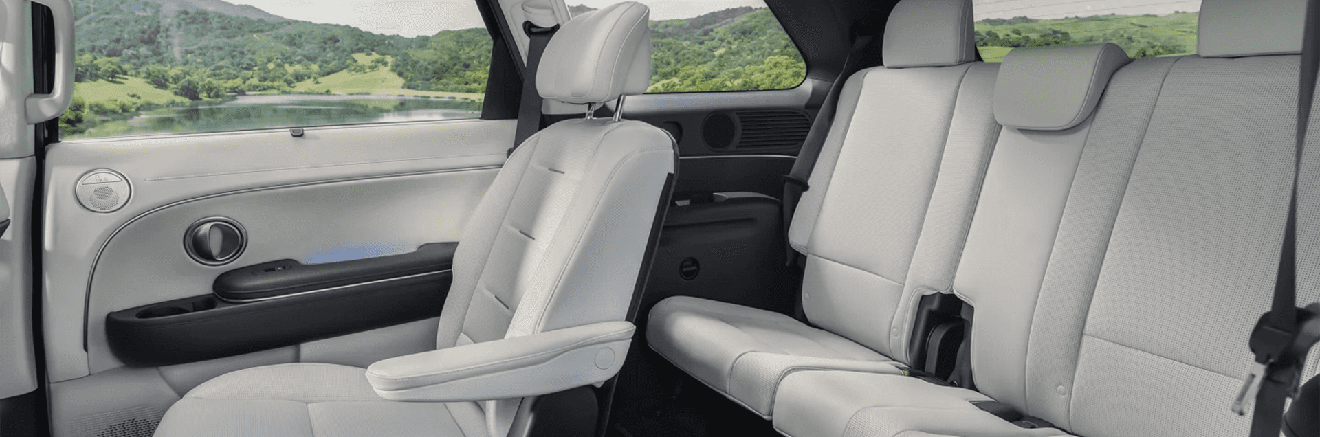 2026 Hyundai Palisade parked with the rear liftgate open, showing cargo space loaded with family gear and travel items.
