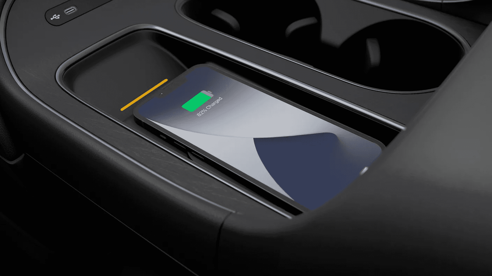 Center console area of a 2026 Hyundai Palisade highlighting USB C ports and a wireless charging area.