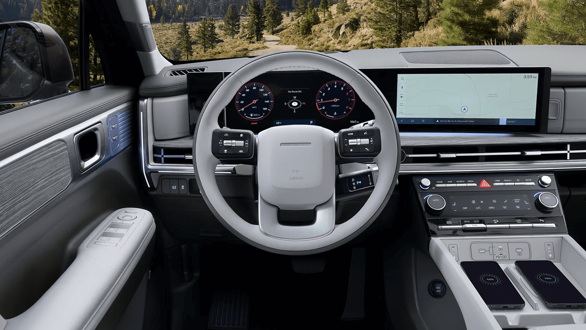 Driver cockpit view of the 2026 Hyundai Santa Fe Hybrid showing a two spoke steering wheel, digital instrument cluster, wide infotainment screen with a map on display, and a center stack with physical knobs and dual wireless charging pads.