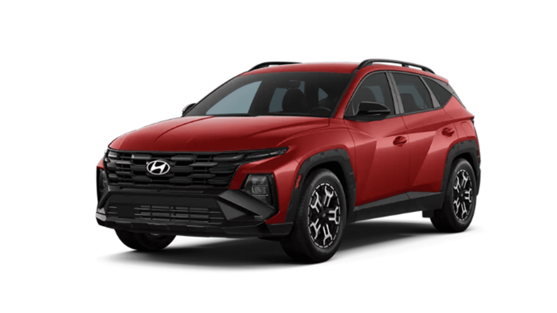 Studio cutout of a red Hyundai Tucson shown from the front three quarter angle on a transparent background, featuring black lower cladding, black grille, roof rails, and patterned alloy wheels.