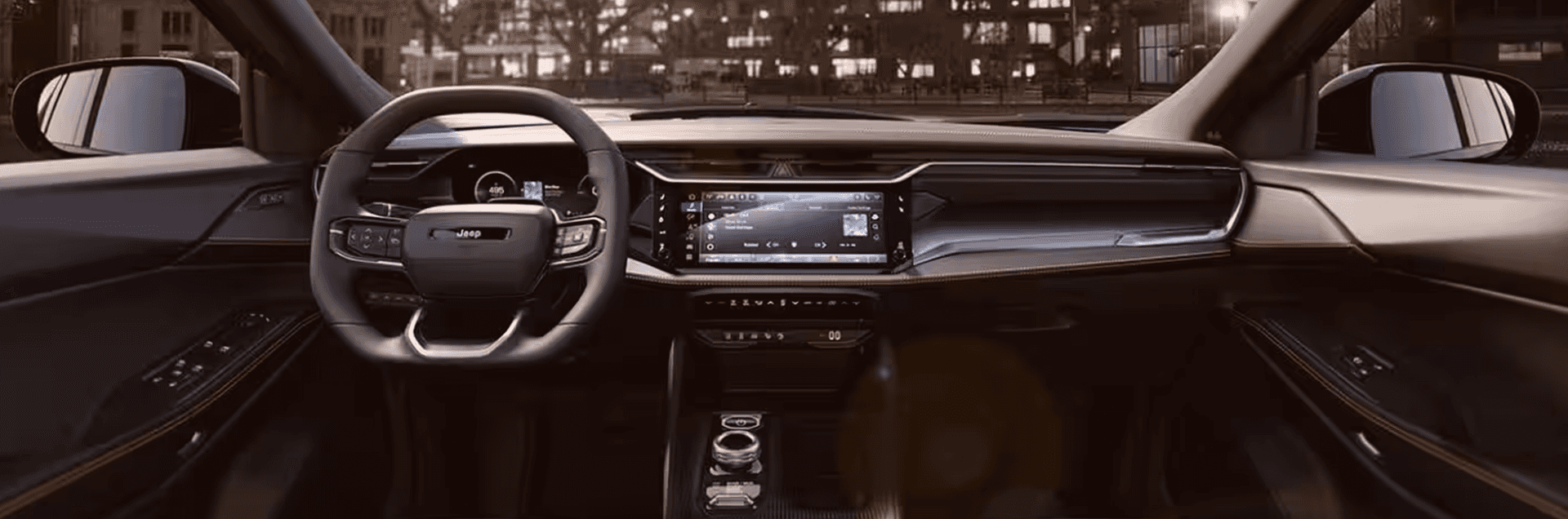 2026 Jeep Cherokee front cabin view with center touchscreen, steering wheel, and digital cluster.