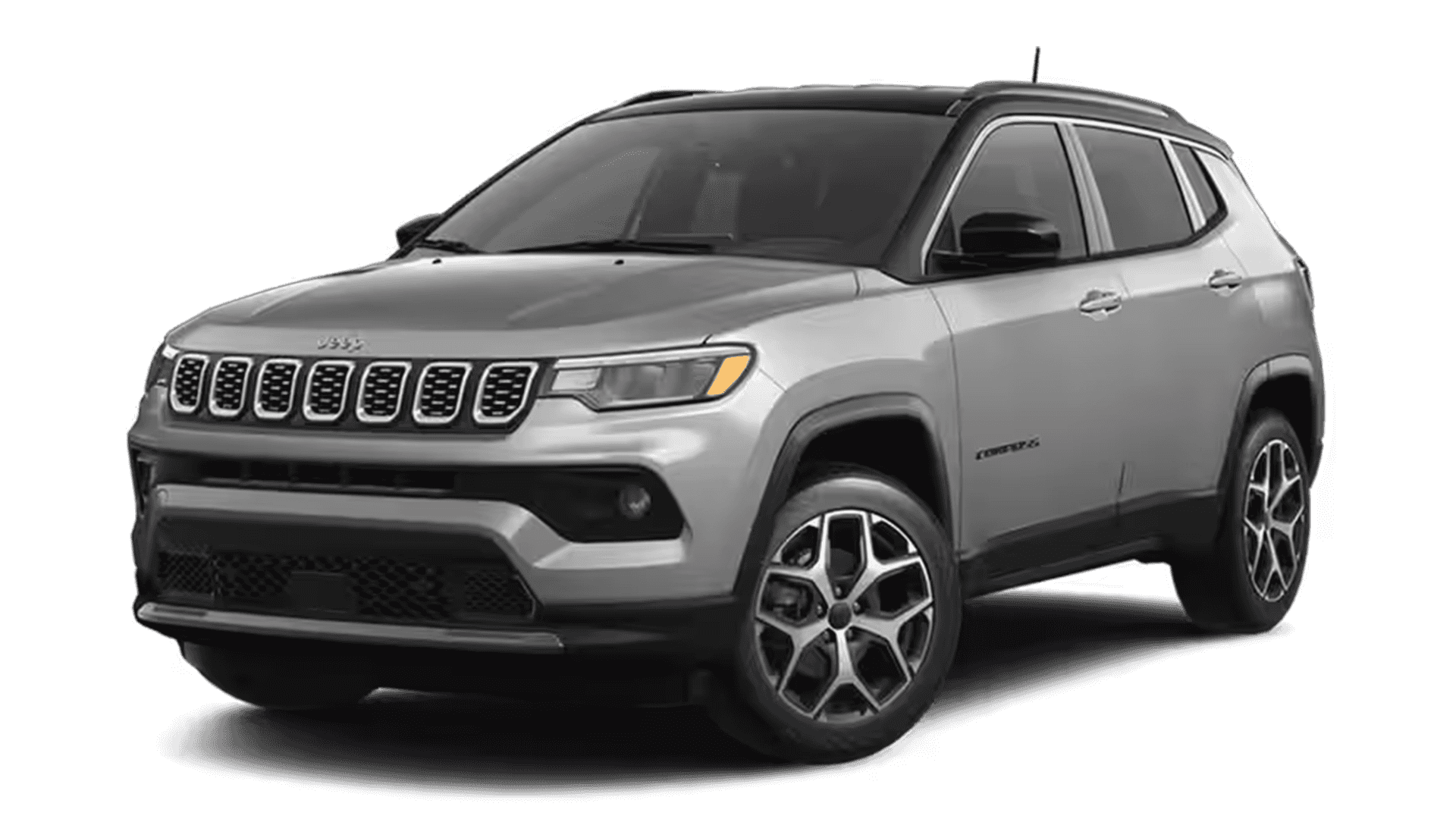 Silver Jeep Compass shown in a front three-quarter studio view on a dark background.