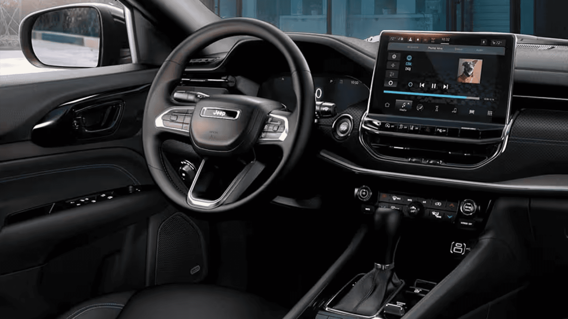 Close cockpit view of the 2026 Jeep Compass interior showing the steering wheel, digital displays, and center touchscreen.