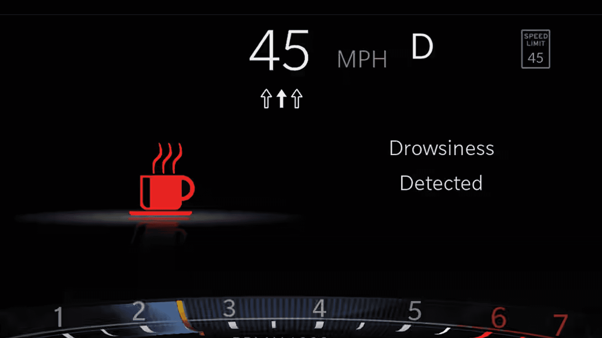 Driver display alert showing a coffee cup icon and the words “Drowsiness Detected,” with speed readout and a speed limit sign.