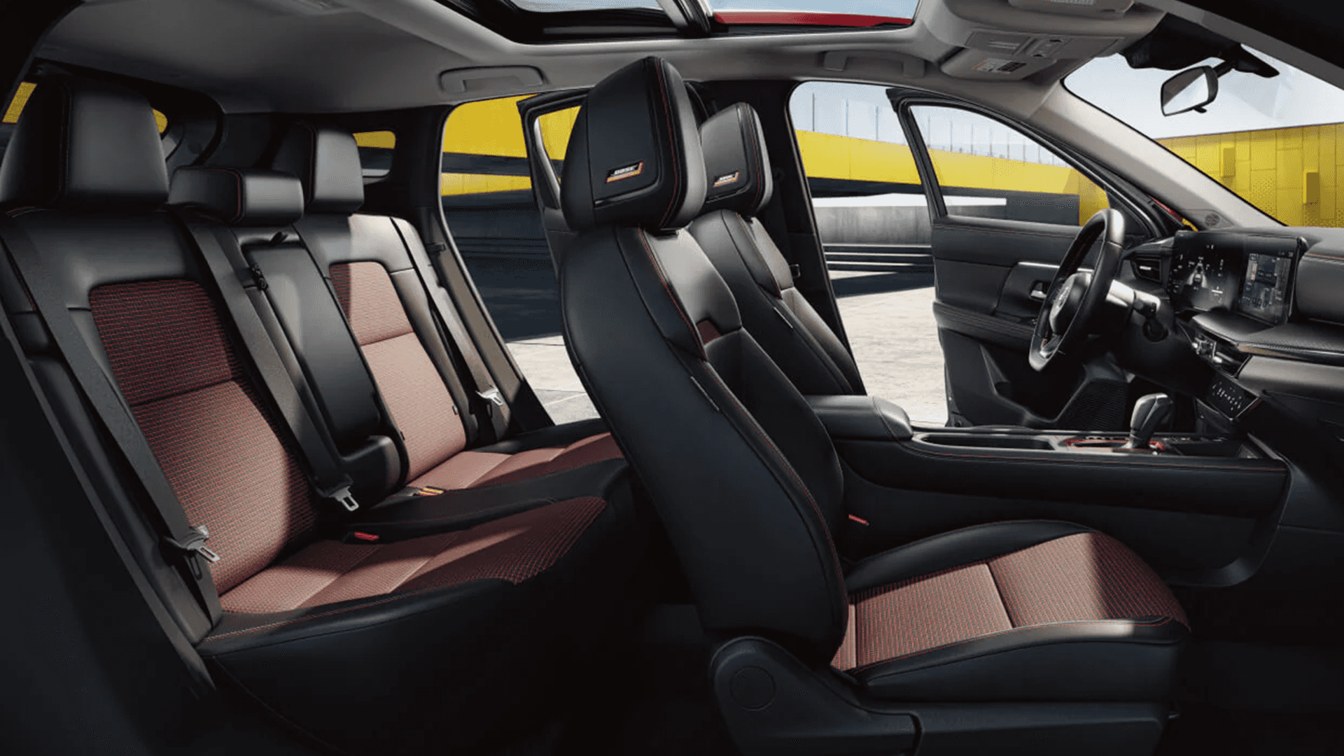 Driver focused interior layout of the 2026 Nissan Kicks with steering wheel and center display