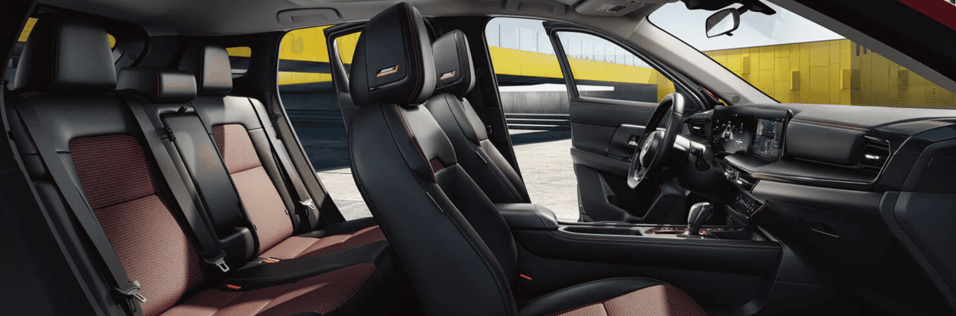 2026 Nissan Kicks interior view showing dashboard and front seating area