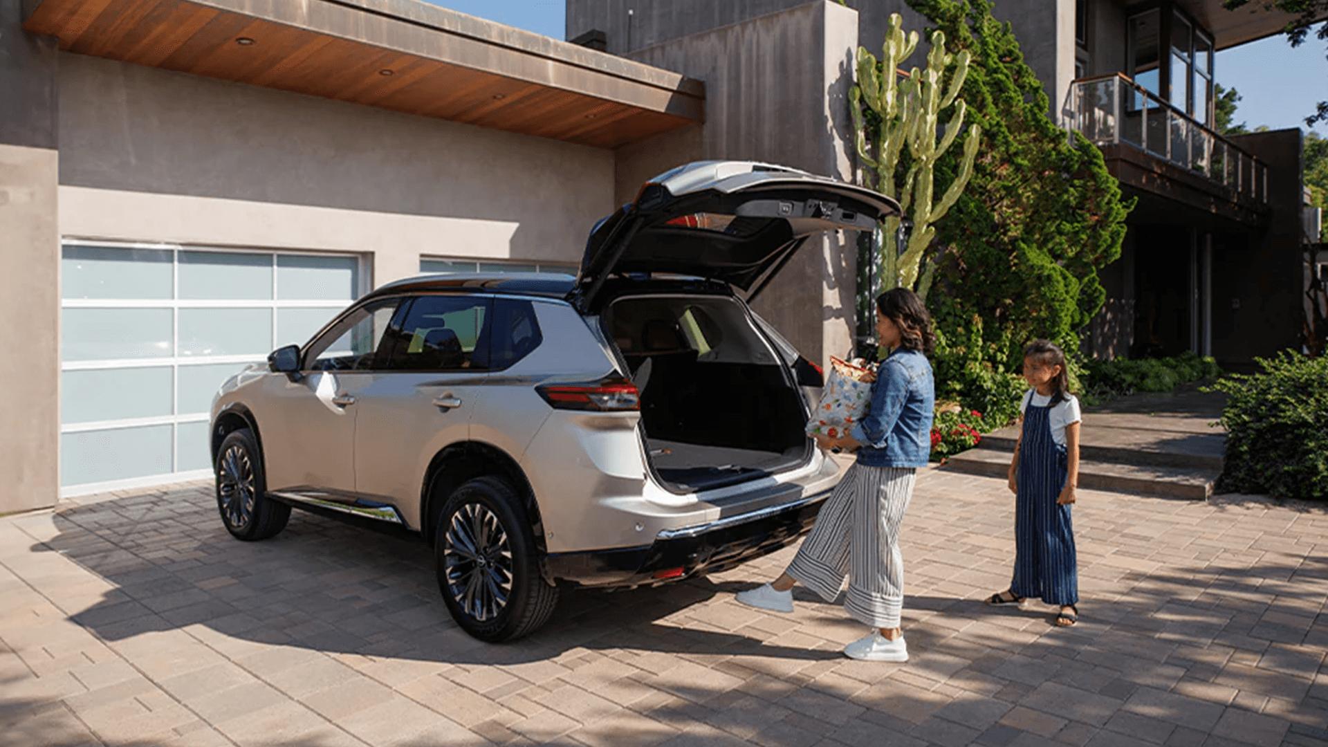 2026 Nissan Rogue with available Motion Activated Liftgate open for loading cargo